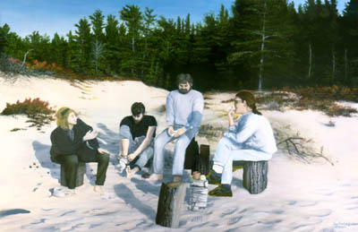 Beachcombers sit on logs in the warm sand in front of the forest, Wilderness State Park Michigan